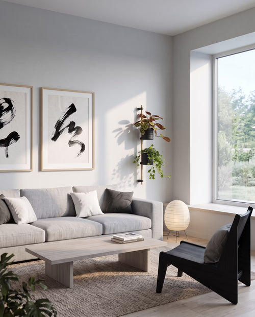 KIMU oak wall planter with two black pots in a Japandi living room next to the window